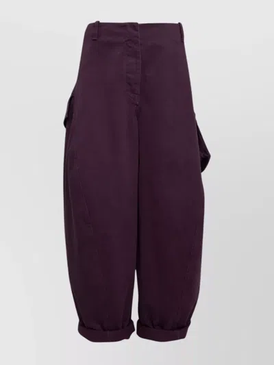 ALAÏA UTILITY TROUSERS WITH SIDE POCKETS AND CUFFS