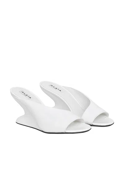 Alaïa Curve 75 Patent Leather Wedges In White