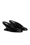 Alaïa Women Mules With Curved Wedges In Noir