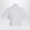Alaïa High Neck Button Detail Cropped Top In White