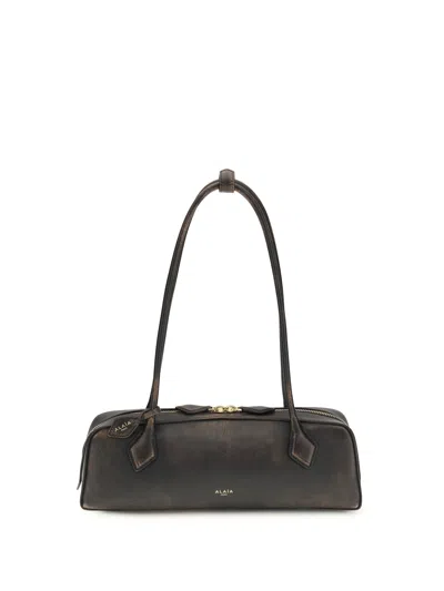 Alaïa Women Le Teckel Shoulder Bag In Aged Leather In Brown