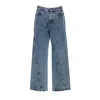 Alaïa Twisted Stonewashed Denim Jeans In Blue
