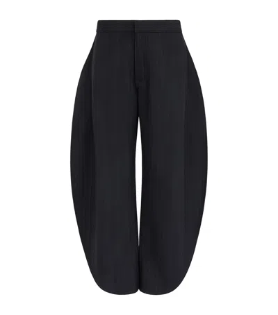 Alaïa Wool Denim Petal Trousers In Black