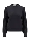Alaïa Wool Sweater With Fringes Detail In Black