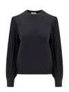 Alaïa Slit Fringe Sleeve Wool Crewneck Sweater In Black