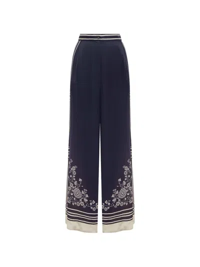 Alemais Banderra Floral-print Silk Trousers In Blue