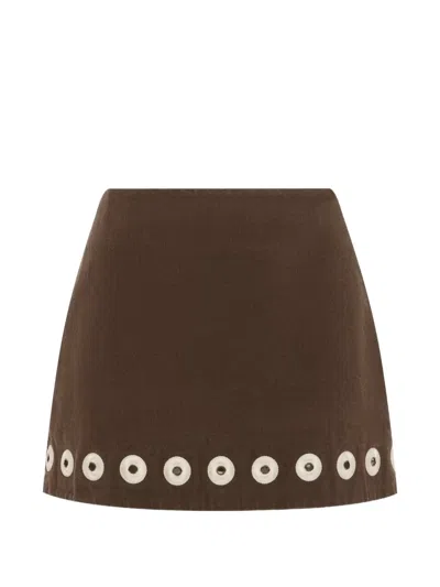 Alemais Tobe Eyelet-embellished Denim Mini Skirt In Brown