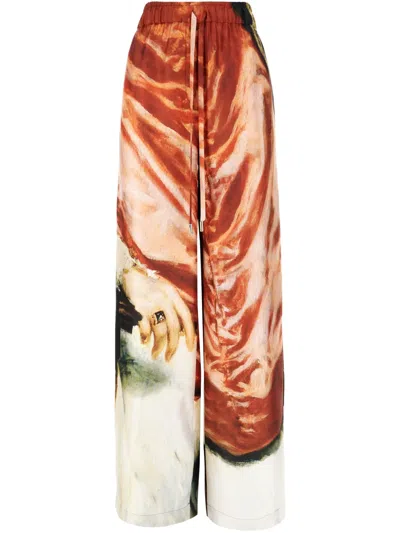 ALEXANDER MCQUEEN ALL-OVER PRINTED TROUSERS