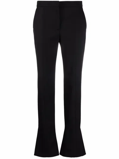 Alexander Mcqueen Tailored Wool Trousers Featuring Flared Hem In Black