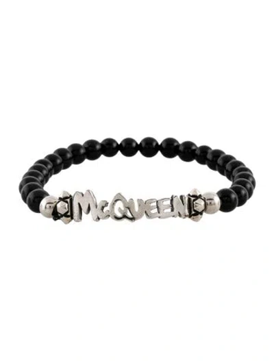 Pre-owned Alexander Mcqueen Beaded Cut-out Logo Bracelet, 7" In Black