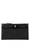 Alexander Mcqueen Skull Embossed Zipped Wallet In Black