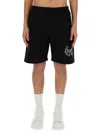 Alexander Mcqueen Alexander Mc Queen Black Bermuda Shorts With Distorted Logo In Black