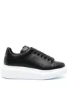 Alexander Mcqueen Women Black Low Top Sneakers With Logo Lettering On Tongue And Heel In Leather Wom In Black