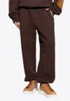 Alexander Mcqueen Contrast-pocket Track Trousers In Brown
