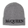 Alexander Mcqueen Logo Embroidered Cashmere Beanie In Gray