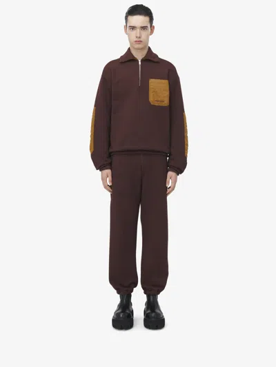 Alexander Mcqueen Contrast-pocket Track Trousers In Brown