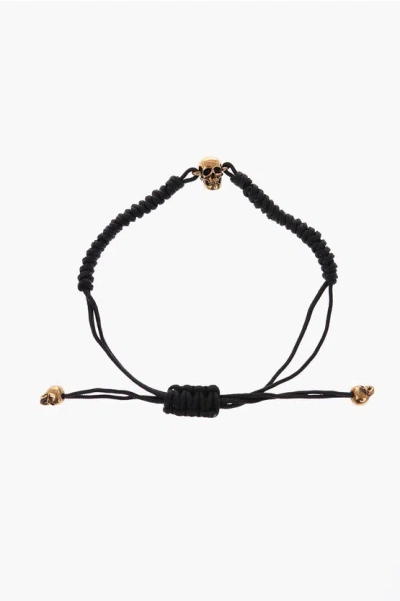 Alexander Mcqueen Cord Bracelet With Adjustable Closure And Golden Skull Charm In Black