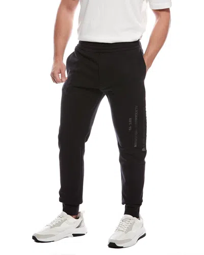 Alexander Mcqueen Cut & Sew Graffiti Print Jogger Pant In Black