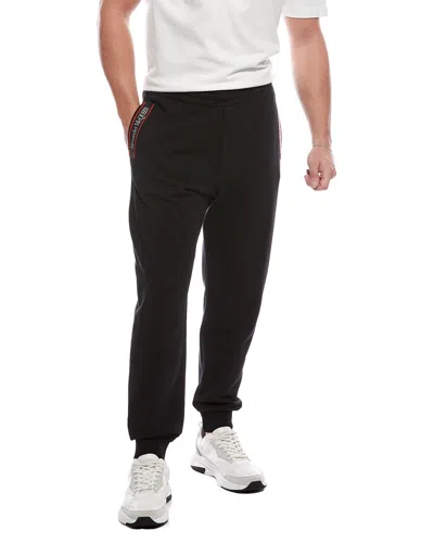 Alexander Mcqueen Cut & Sew Logo Tape Jogger Pant In Black