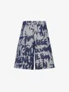 Alexander Mcqueen Graffiti Printed Bermuda Denim Shorts In Indigo