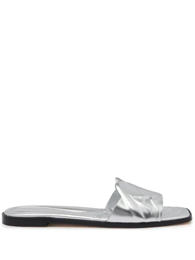 ALEXANDER MCQUEEN EMBOSSED-LOGO SLIDES