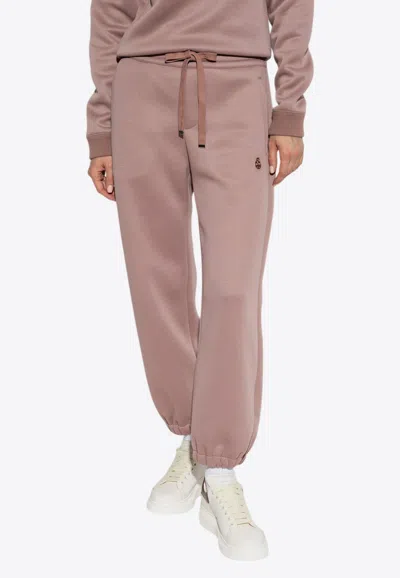 Alexander Mcqueen Embroidered -skull Track Pants In Pink