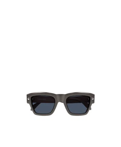 Alexander Mcqueen Engraved-logo Arm Sunglasses In Gray