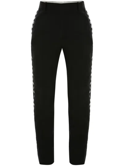 ALEXANDER MCQUEEN EYELET-DETAIL SLIM-CUT TROUSERS