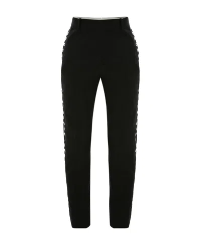 Alexander Mcqueen Eyelet-detail Slim-cut Trousers In Black