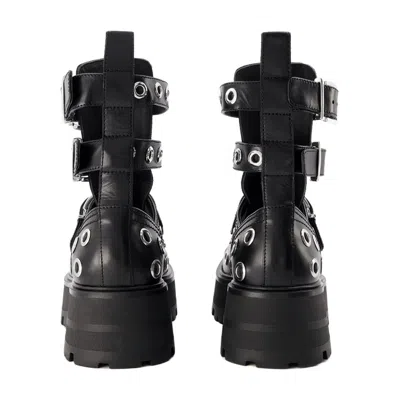 Alexander Mcqueen Eyelet-studded Leather Ankle Boot In Black