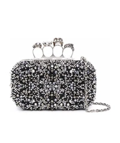 ALEXANDER MCQUEEN ALEXANDER MCQUEEN FOUR-RING SKULL STUD EMBELLISHED CLUTCH BAG