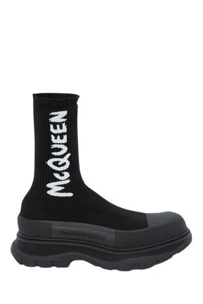 ALEXANDER MCQUEEN ALEXANDER MCQUEEN GRAFFITI KNIT TREAD SLICK BOOT IN BLACK/WHITE