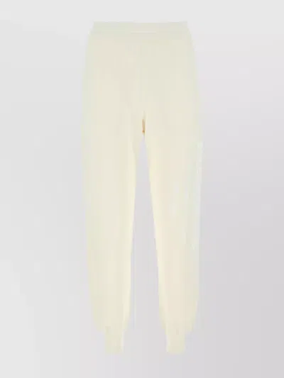 Alexander Mcqueen Graffiti Print Cotton Joggers In Beige