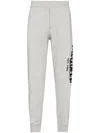 Alexander Mcqueen Graffiti-print Track Pants In Grey