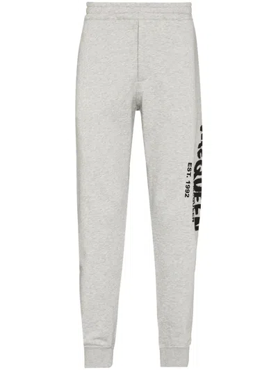 Alexander Mcqueen Graffiti-print Track Pants In Grey