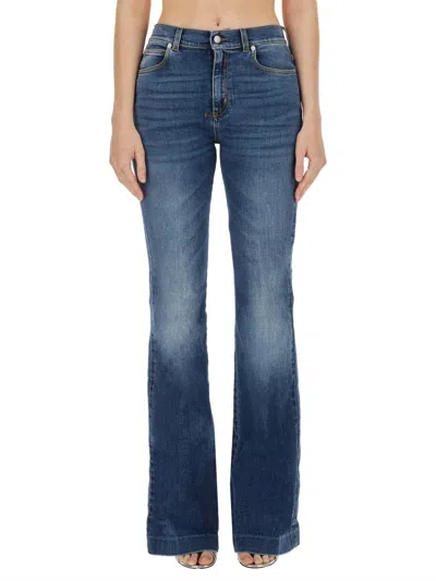 Alexander Mcqueen Faded Flared Jeans In Blue