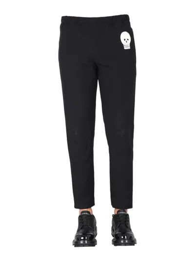 Alexander Mcqueen Jogging Pants With Embroidered Skull In Black