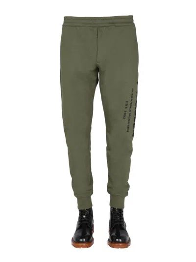 ALEXANDER MCQUEEN ALEXANDER MCQUEEN JOGGING PANTS WITH GRAFFITI LOGO
