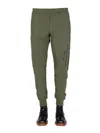 Alexander Mcqueen Jogging Pants With Graffiti Logo In Brown