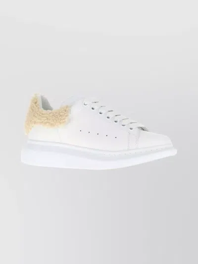 ALEXANDER MCQUEEN LEATHER SNEAKERS FEATURING SHEARLING HEEL TRIM
