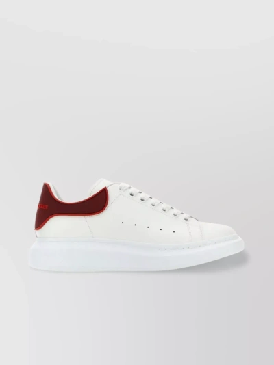 ALEXANDER MCQUEEN LEATHER SNEAKERS WITH OVERSIZED SOLE AND CONTRASTING RUBBER HEEL
