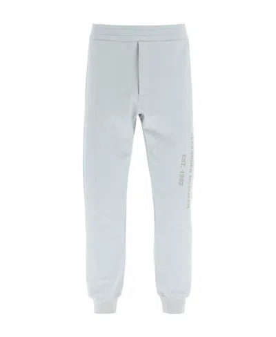ALEXANDER MCQUEEN ALEXANDER MCQUEEN GRAFFITI-PRINTED TAPERED TRACK PANTS