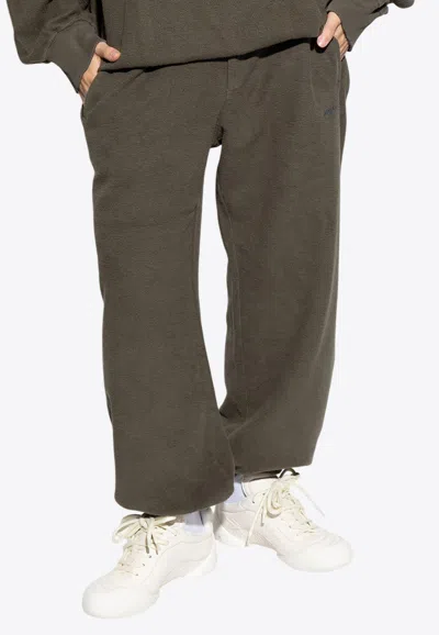 Alexander Mcqueen Logo Print Track Pants In Brown