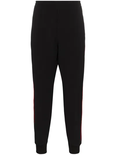 Alexander Mcqueen Logo Tape Track Pants In Black