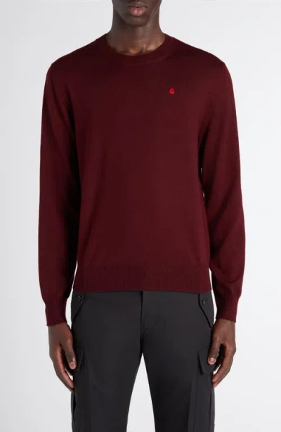 Alexander Mcqueen Mcqueen Embroidered Skull Wool Crewneck Sweater In Burgundy