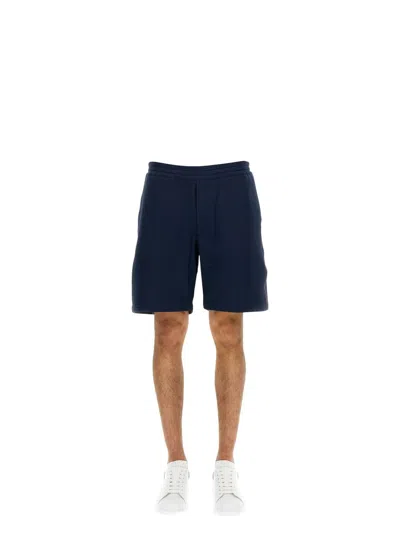 Alexander Mcqueen Men's Bermuda Shorts With Selvedge Logo Band In Blue