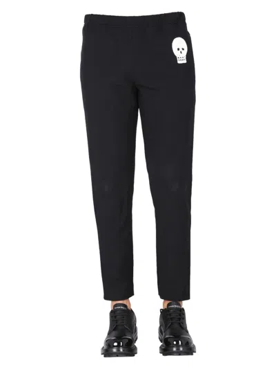 ALEXANDER MCQUEEN MEN'S JOGGING PANTS WITH EMBROIDERED SKULL