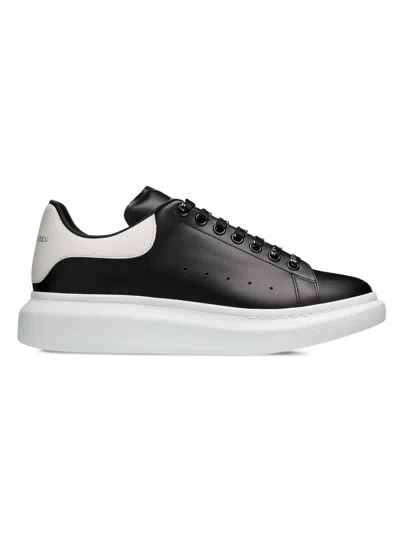 Alexander Mcqueen Black Low Top Sneakers With Logo Lettering On The Tongue In Leather Man