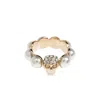 Alexander Mcqueen Crystal And Pearl Skull Rings In Gold