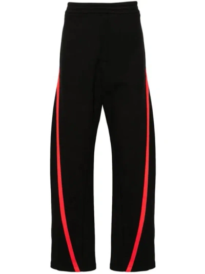 Alexander Mcqueen Striped Mid-rise Track Trousers In Black